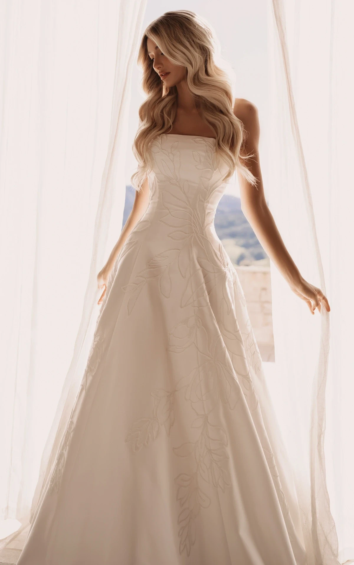 Model in white Martina Liana Wedding dress