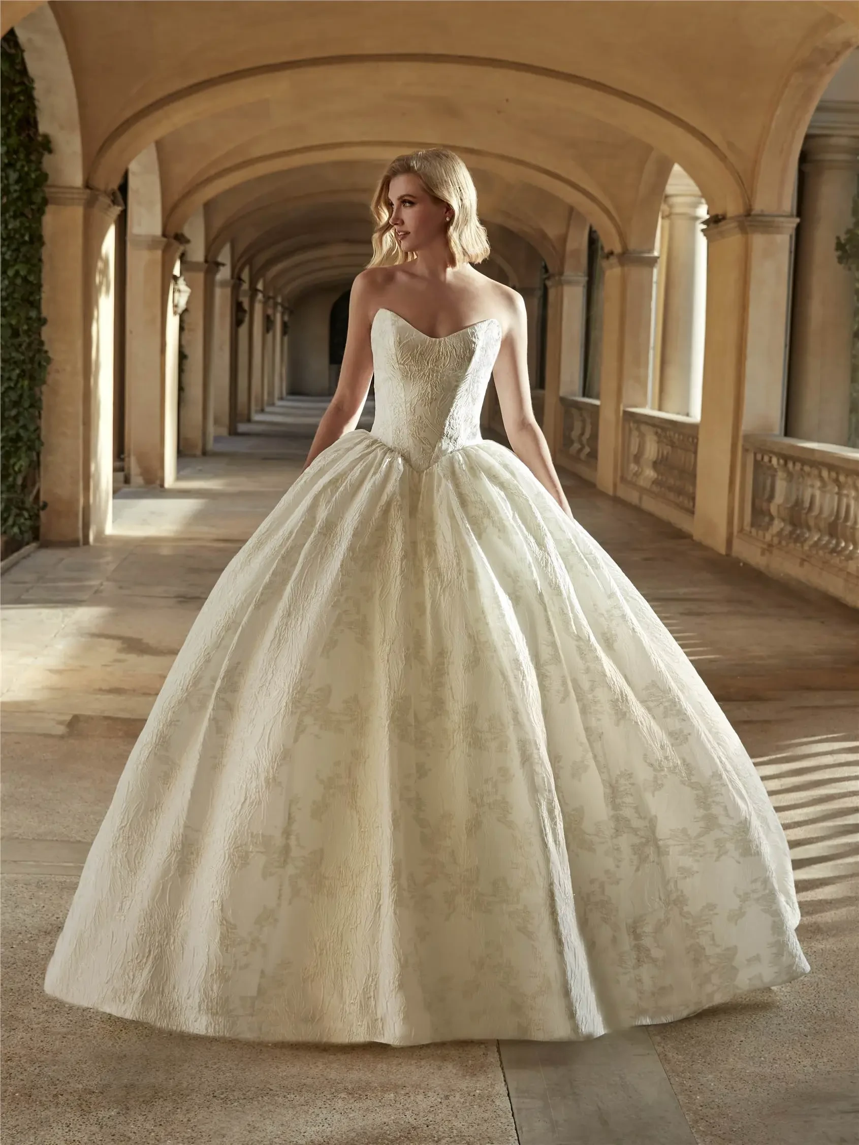 Model wearing Pronovias Privee wedding gown